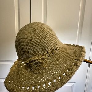 handmade-style crocheted sun hat with floral decoration